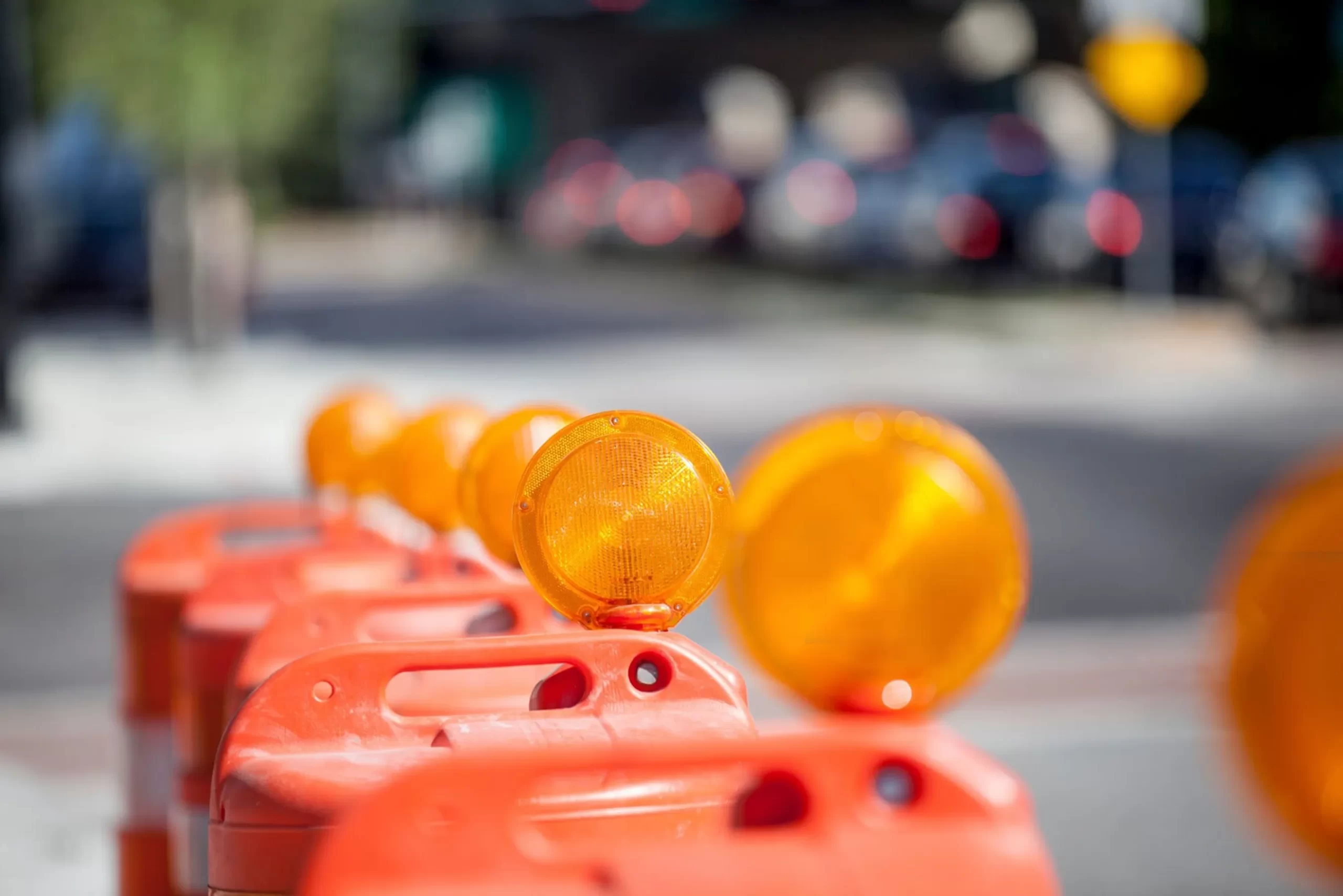 Road construction safety barrels abstract background