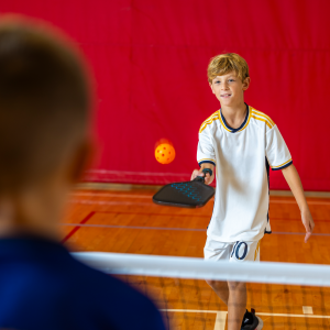 two young boys playing pickleball at the rec complex in fairview heights